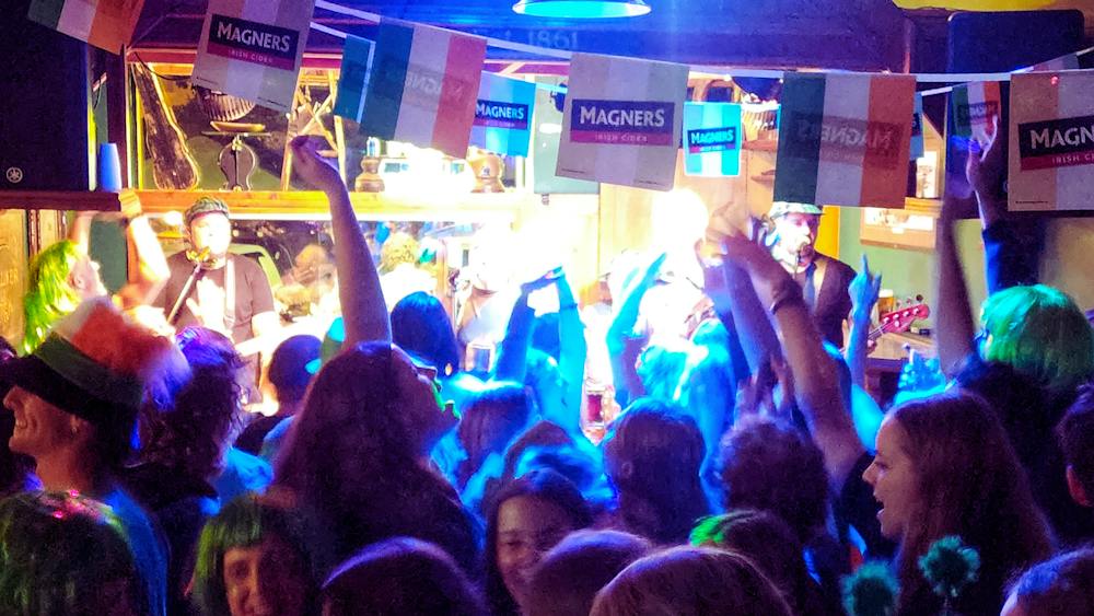 People are dancing on the dancefloor on St Patrick's Day