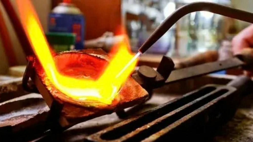 Metal heating over a flame