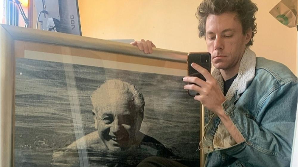 james.haha.nice holding a photo of Harold Holt swimming