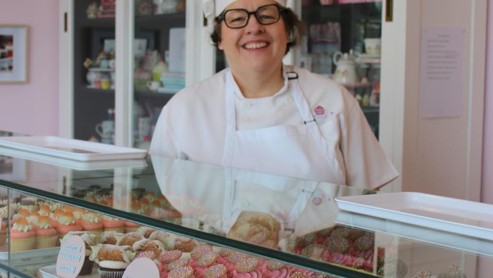 Owner behind the counter